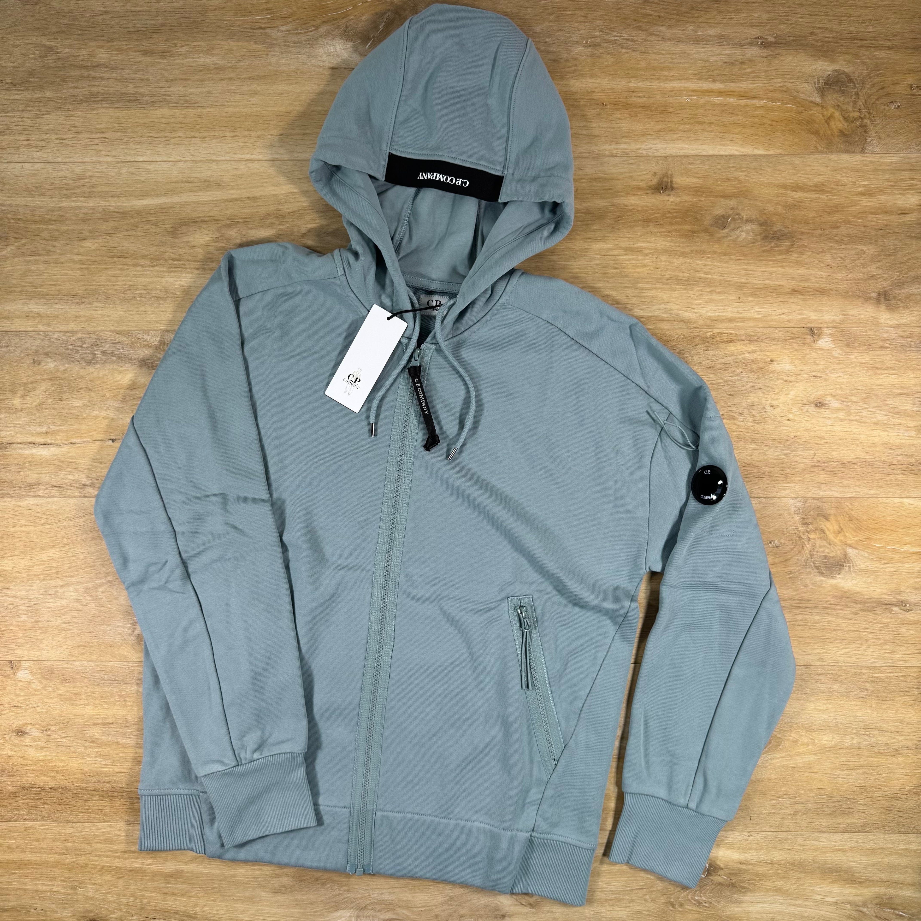 C.P. Company Diagonal Raised Zipped Lens Hoodie in Silver Blue